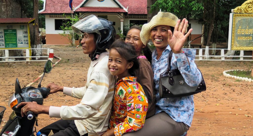 Cambodian family traveling on a motor bike.