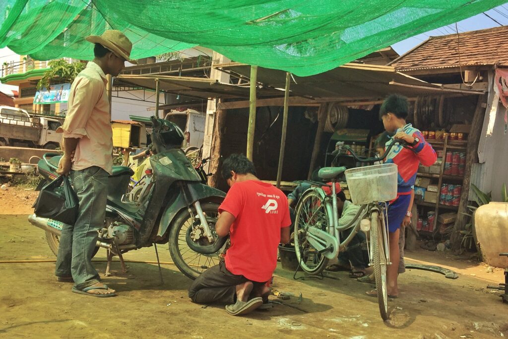 Roadside mechanic, Cambodia.