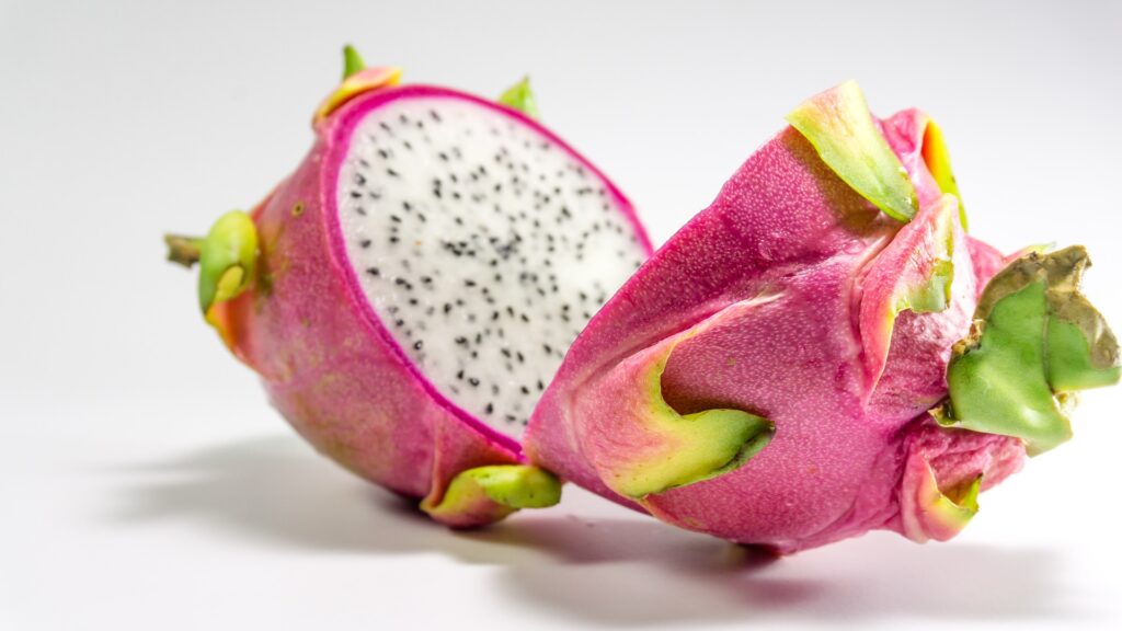 A white-fleshed dragonfruit cut in half.