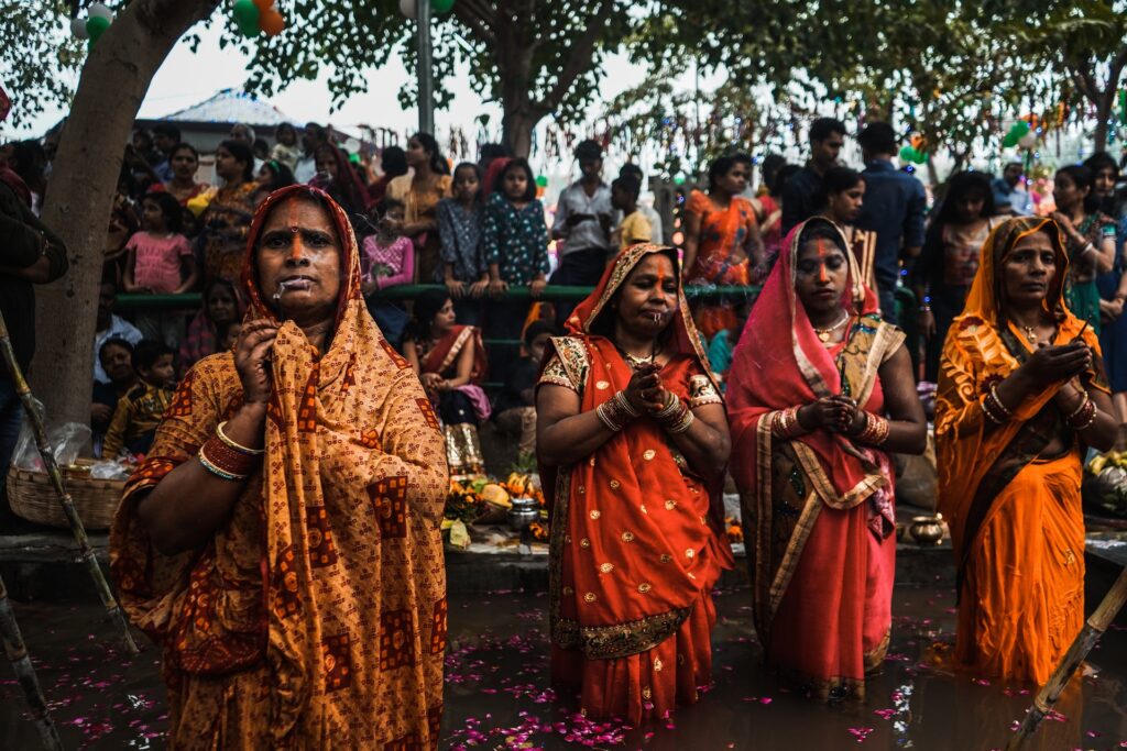 Indian women conduct a ceremony, living in the tropics.